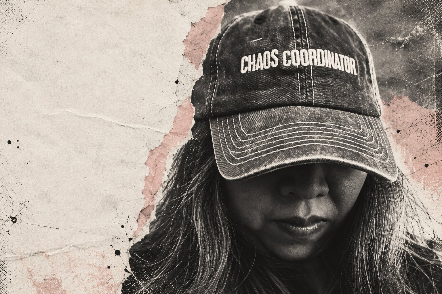 Alissa in a 'Chaos Coordinator' cap, face shaded by the brim